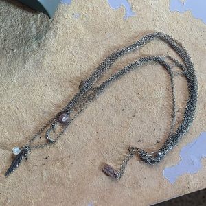 A triple connected necklace with no damages or tangles for $5